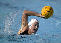 Close up of a female water polo player during a match at the Athens Olympics, Greece 2004.