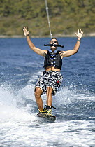A wakeboarder holding onto the rope with his teeth, Marverde, Turkey.