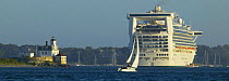 Cruise ship at anchor off Newport's Rose Island lighthouse, Rhode Island, USA.