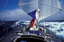 Crew aboard the 1981-82 Whitbread winner "Flyer" repairing broken boom in Southern Ocean while running goose-winged with dacron and nylon reachers.