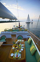 Breakfast served in the cockpit of 116ft Ted Hood designed superyacht "Whisper" off Jamestown, Rhode Island, USA