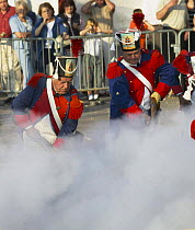 Men with guns surrounded by smoke during The Bravade, a historical annual celebration that takes place in Saint Tropez, South of France.