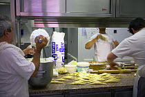 Men making croissants in a St Tropez bakery, South of France.