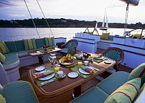 Breakfast served in the cockpit of the 116ft Ted Hood designed superyacht "Whisper" off Jamestown, Rhode Island, USA.