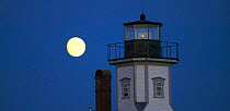 Moon rise over the Rose Island Lighthouse, Newport, Rhode Island, USA.