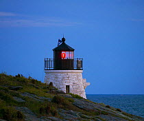 Castle Hill Lighthouse (Est 1890) at dusk near Newport, Rhode Island, marking the East Passage into Narragansett Bay.