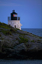 Castle Hill Lighthouse (Est 1890) at dusk near Newport, Rhode Island, marking the East Passage into Narragansett Bay.