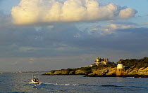 Established in 1890, the Castle Hill Lighthouse and Castle Hill Inn mark the East Passage into Narragansett Bay, near Newport, Rhode Island, USA.