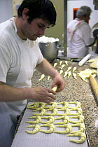 Making croissants in a St Tropez bakery, France.