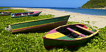 A few fishing boats on a beach near Green Island, north shore of Grenada, Caribbean.