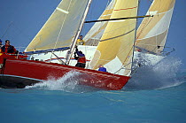 Approaching the weather mark, two boats at Key West Race Week preparing for a spinnaker hoist, Florida, USA.