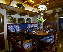 The dining area of the 105ft classic Bruce King ketch "Whitehawk".