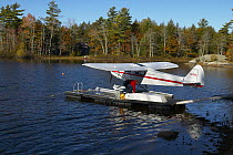 Seaplane docked on the water, Maine, USA.