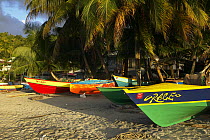 Local fishing boats on the beach in the town of Gouyave, Grenada, Caribbean.