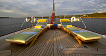 Deck chairs on the aft deck of 116ft superyacht "Whisper" at sunrise, New England, USA.