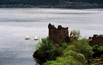 Great Glen Raid competitors sailing past Urquhart Castle in Loch Ness, Scotland. ^^^Rowing in the narrow stretches and sailing through the lochs, the Great Glen Raid competitors cross Scotland along t...