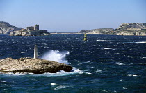Chateau d'If in a strong mistral wind off the town of Marseille, France. The castle, built in 1524 on the Isle of If off Marseille, was used for many years as a state prison and earned fame in the 'Co...