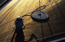 Coiled rope on the foredeck of a "Tofinou" boat, originating from Ile de Ré near La Rochelle. Charente maritime, France.