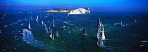 The fleet rounding the Needles, during the America's Cup Jubilee in 2001, Isle of Wight, UK.
