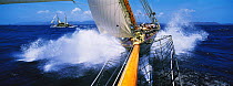 115ft Schooner "Mariette", with her tender "Atlantide" alongside, seen from the tip of the bowsprit, Antigua Classic Yacht Regatta, Caribbean, 2005. Property Released.