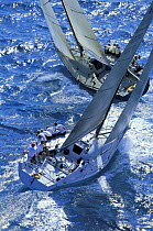 One-design class Farr 40's cross tacking upwind at SORC, Florida.