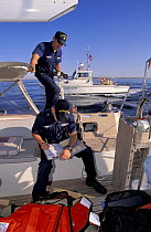 US Coastguard doing routine checks onboard a yacht off Boston, USA