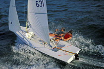 Sailing students sailing a Vanguard 15 dinghy hiking-out with a stiff breeze. Newport, Rhode Island, USA.