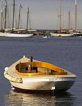 Wooden launch "Baguette" and cabin cruiser moored in Vineyard Haven, Martha's Vineyard, Massachusetts, USA.