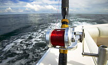 Deep sea fishing reel aboard a motorboat.