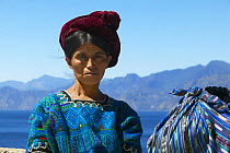 Local lady in traditional hand-woven native dress / huipil, Lake Atitlan, Guatemala.