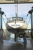 Pressure washing cruising yacht "Lily Pad" at the end of the season.