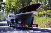Eric Tabarly's yacht "Pen Duick" being transported on a truck by road. Pen Duick is 15.10m long with a beam of 2.93m with a 10 ton displacement.
