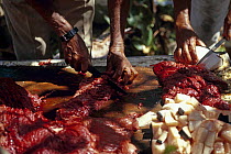 Locals from the island of Bequia butchering Humpback whale (Megaptera novaeangliae) meat. Bequia, St Vincent and the Grenadines, Caribbean. They have a license from the whaling commission to take 2 wh...