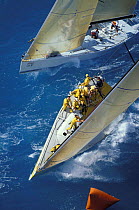 Aerial view of race yachts rounding the windward mark.