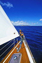 A member of the crew on the bow of "Realite", St Maarten, Caribbean. Model and Property Released.