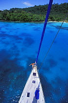 View from the top of the mast of a cruising yacht anchored at Champagne Beach, Vanuatu.