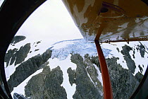 Glacier and mountain, seen from the inside of a seaplane, Alaska.