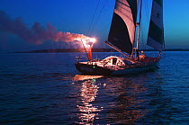 Open 60 Tommy Hilfiger Freedom America yacht, skippered by Brad van Liew, completing the Around Alone race at dawn, Newport, Rhode Island, USA.
