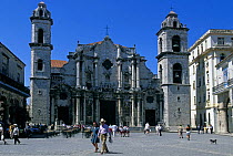 People walking in front of Cathedral de San Cristobal, Plaza de la Cathedral, Havana, Cuba.