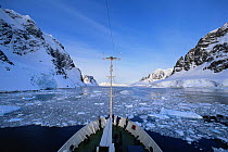 Bow of expedition cruise ship "Professor Molvanov" cruising through the icy Gerlache Strait, Antarctic Peninsula.