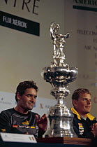 Russell Coutts (on the left) and Dean Barker (on the right) who helmed the Team New Zealand boat in the 5th race which they won, with the America's Cup trophy, 2000.