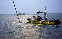 Sea tow salvaging a sunken yacht, Newport, Rhode Island, USA.