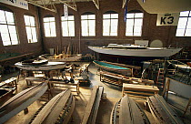 Boats in a workshop at the International Yacht Restoration School (IYRS), Newport, Rhode Island, USA.
