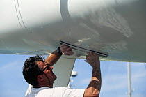 Fairing the hull of a racing yacht to get a smooth hull shape.
