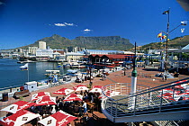 The Victoria and Albert (V&A) waterfront with table mountain in the distance, Cape Town, South Africa.