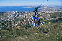 Cable car ride to the top of Table Mountain with a vast view across Cape Town, South Africa.