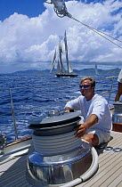 Trimming the sails on a megayacht in St Barts, Caribbean.