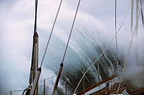 Yacht "Sariyah" crashing through rough seas near Cape Horn, Chile.