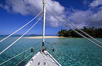 From aboard 88ft sloop ^Shaman^, people swimming off a small island in the Vava'u group, Tonga, South Pacific.