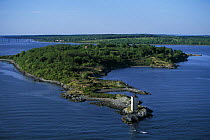 Dutch Island Lighthouse situated on the west passage of Narragansett Bay, Jamestown, Rhode Island, USA. ^^^Built in 1857 and discontinued in 1979, the lighthouse is 56ft tall.